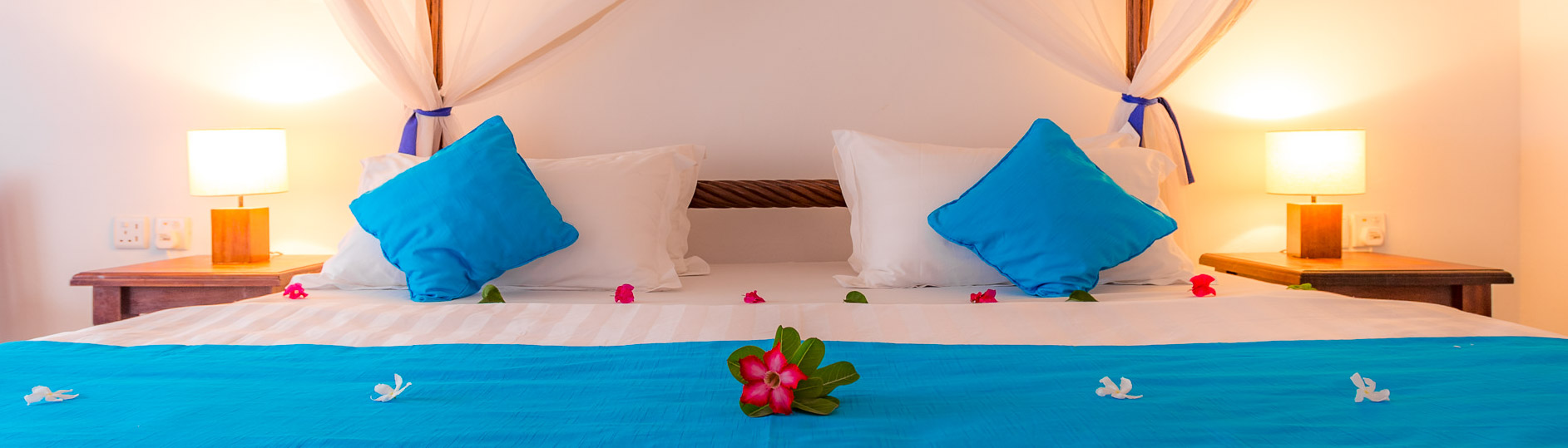 Decorated four-poster bed in a room at Diani Sea Lodge